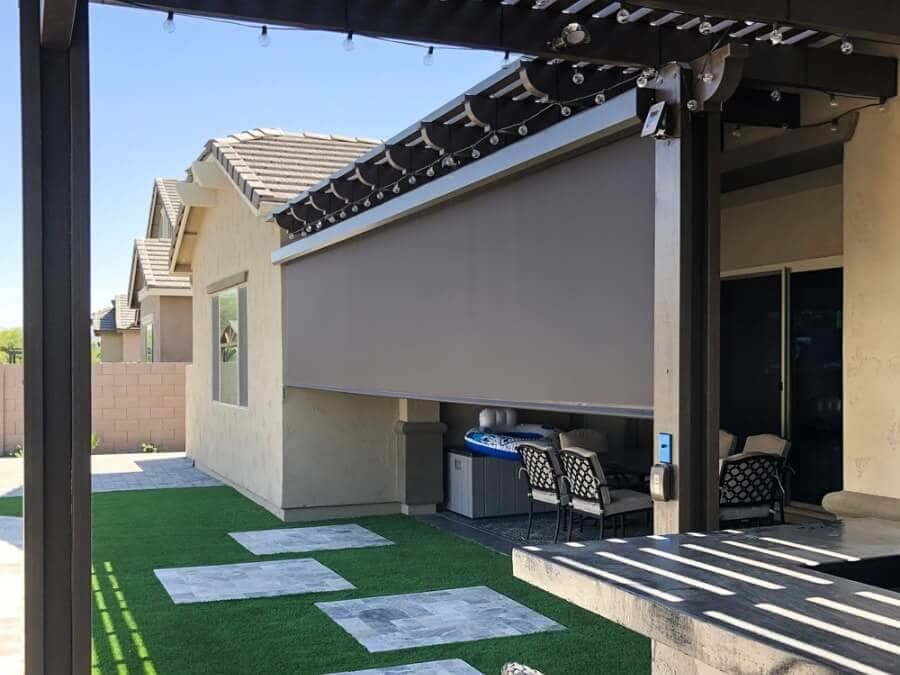 Mechanical roll down screens for a back porch offering easy customization.