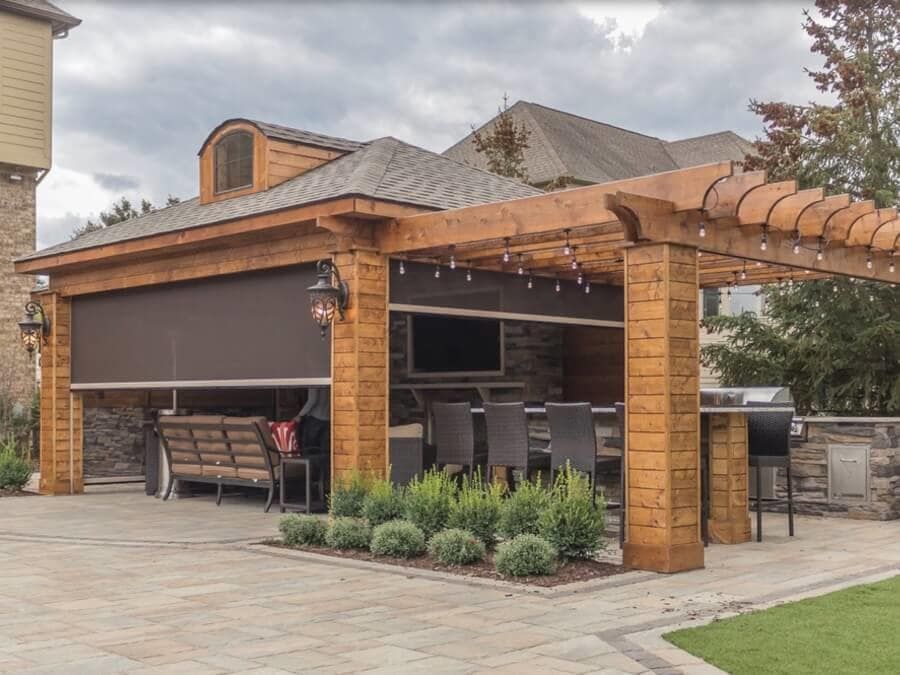 Automated screens attached to an outdoor patio area.