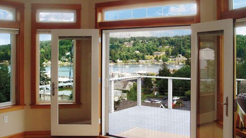 A Screenmobile custom sized screen door covers a full 2 door opening.