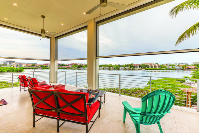 lakeside commercial deck with retractable shades
